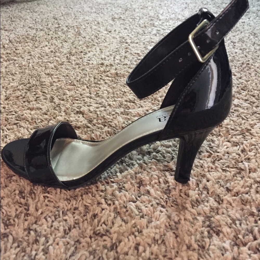 Women’s black high heeled shoes.